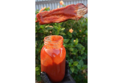 Smoked pork belly skewers dipped into homemade smoky BBQ sauce